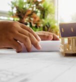 Hands of Engineer working on blueprint,Construction concept. Engineering tools.Vintage tone retro filter effect,soft focus(selective focus)